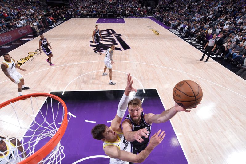 SACRAMENTO, CA - MARCH 31: Domantas Sabonis #10 of the Sacramento Kings drives to the basket during the game against the Utah Jazz on March 31, 2024 at Golden 1 Center in Sacramento, California. NOTE TO USER: User expressly acknowledges and agrees that, by downloading and or using this Photograph, user is consenting to the terms and conditions of the Getty Images License Agreement. Mandatory Copyright Notice: Copyright 2024 NBAE (Photo by Rocky Widner/NBAE via Getty Images)