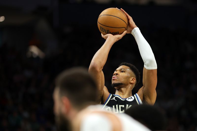 MILWAUKEE, WISCONSIN - JANUARY 26: Giannis Antetokounmpo #34 of the Milwaukee Bucks shoots a free throw during the first half of a game against the Cleveland Cavaliers at Fiserv Forum on January 26, 2024 in Milwaukee, Wisconsin. NOTE TO USER: User expressly acknowledges and agrees that, by downloading and or using this photograph, User is consenting to the terms and conditions of the Getty Images License Agreement. (Photo by Stacy Revere/Getty Images)