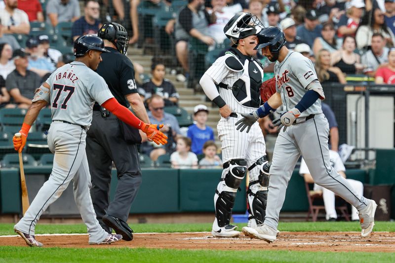 Aug 24, 2024; Chicago, Illinois, USA; Detroit Tigers outfielder Matt Vierling (8) celebrates with second baseman Andy Ibanez (77) as he crosses home plate after hitting a solo home run against the Chicago White Sox during the third inning at Guaranteed Rate Field. Mandatory Credit: Kamil Krzaczynski-USA TODAY Sports