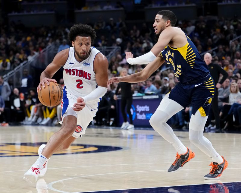 INDIANAPOLIS, INDIANA - FEBRUARY 22: Cade Cunningham #2 of the Detroit Pistons dribbles the ball while being guarded by Tyrese Haliburton #0 of the Indiana Pacers in the third quarter at Gainbridge Fieldhouse on February 22, 2024 in Indianapolis, Indiana. NOTE TO USER: User expressly acknowledges and agrees that, by downloading and or using this photograph, User is consenting to the terms and conditions of the Getty Images License Agreement. (Photo by Dylan Buell/Getty Images)