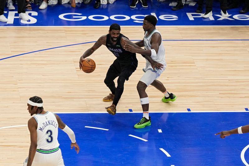 MINNEAPOLIS, MN -  MAY 24:  Kyrie Irving #11 of the Dallas Mavericks handles the ball during the game against the Minnesota Timberwolves during Round 3 Game 2 of the 2024 NBA Playoffs on May 24, 2024 at Target Center in Minneapolis, Minnesota. NOTE TO USER: User expressly acknowledges and agrees that, by downloading and or using this Photograph, user is consenting to the terms and conditions of the Getty Images License Agreement. Mandatory Copyright Notice: Copyright 2024 NBAE (Photo by Jordan Johnson/NBAE via Getty Images)