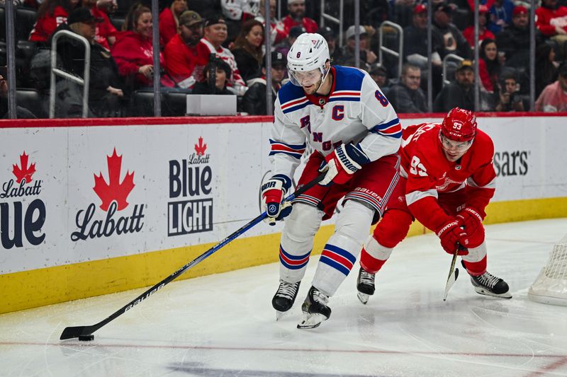 Apr 5, 2024; Detroit, Michigan, USA; New York Rangers defenseman Jacob Trouba (8) and Detroit Red Wings right wing Alex DeBrincat (93) battle for the puck during the second period at Little Caesars Arena. Mandatory Credit: Tim Fuller-USA TODAY Sports