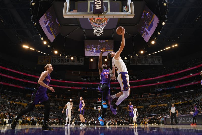 LOS ANGELES, CA - NOVEMBER 10: Austin Reaves #15 of the Los Angeles Lakers drives to the basket during the game against the Toronto Raptors on November 10, 2024 at Crypto.Com Arena in Los Angeles, California. NOTE TO USER: User expressly acknowledges and agrees that, by downloading and/or using this Photograph, user is consenting to the terms and conditions of the Getty Images License Agreement. Mandatory Copyright Notice: Copyright 2024 NBAE (Photo by Adam Pantozzi/NBAE via Getty Images)