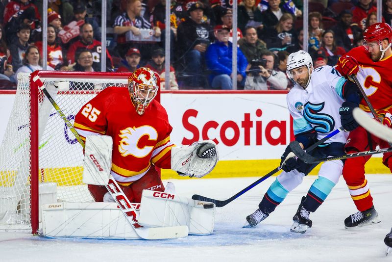 Mar 4, 2024; Calgary, Alberta, CAN; Calgary Flames goaltender Jacob Markstrom (25) makes a save against the Seattle Kraken during the first period at Scotiabank Saddledome. Mandatory Credit: Sergei Belski-USA TODAY Sports