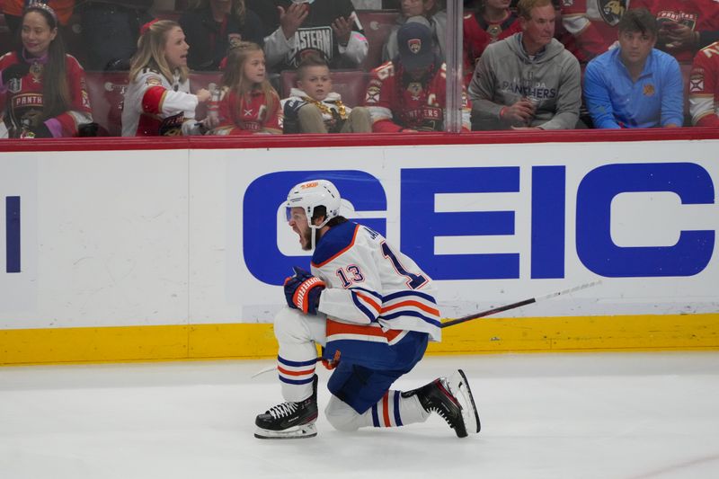 Jun 24, 2024; Sunrise, Florida, USA; Edmonton Oilers forward Mattias Janmark (13) celebrates scoring against Florida Panthers goaltender Sergei Bobrovsky (72) during the first period in game seven of the 2024 Stanley Cup Final at Amerant Bank Arena. Mandatory Credit: Jim Rassol-USA TODAY Sports