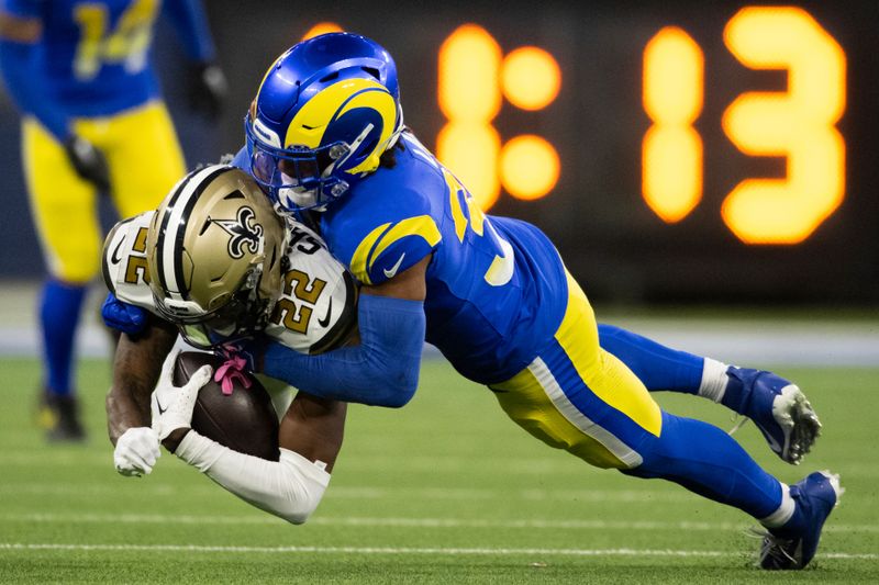 Los Angeles Rams safety Quentin Lake (37) tackles New Orleans Saints wide receiver Rashid Shaheed (22) during an NFL football game, Thursday, Dec. 21, 2023, in Inglewood, Calif. (AP Photo/Kyusung Gong)