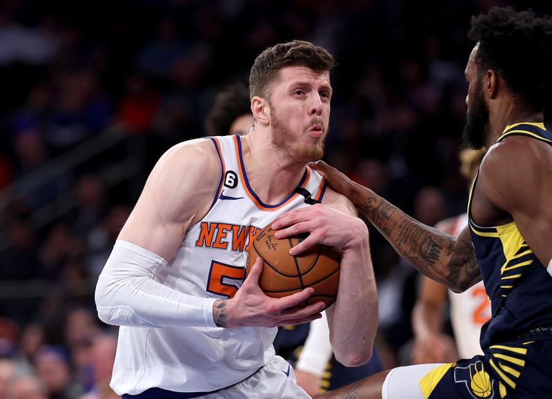 NEW YORK, NEW YORK - APRIL 09:  Isaiah Hartenstein #55 of the New York Knicks and Oshae Brissett #12 of the Indiana Pacers fight for the ball at Madison Square Garden on April 09, 2023 in New York City. NOTE TO USER: User expressly acknowledges and agrees that, by downloading and or using this photograph, User is consenting to the terms and conditions of the Getty Images License Agreement. (Photo by Elsa/Getty Images)