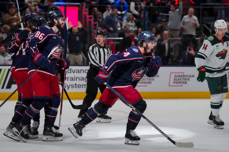 Jan 6, 2024; Columbus, Ohio, USA;  Columbus Blue Jackets center Cole Sillinger (4) celebrates with teammates after scoring a hat-trick goal against the Minnesota Wild in the third period at Nationwide Arena. Mandatory Credit: Aaron Doster-USA TODAY Sports