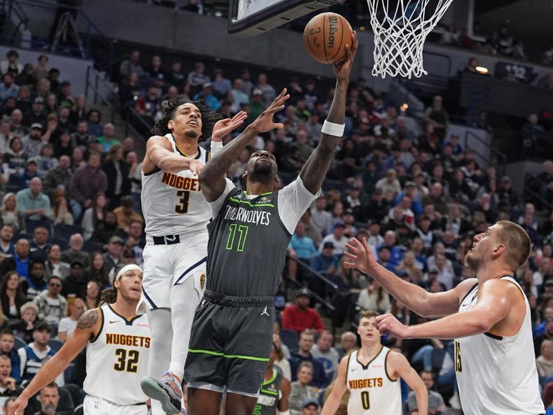 MINNEAPOLIS, MN - NOVEMBER 1: Naz Reid #11 of the Minnesota Timberwolves drives to the basket during the game against the Denver Nuggets on November 1, 2024 at Target Center in Minneapolis, Minnesota. NOTE TO USER: User expressly acknowledges and agrees that, by downloading and or using this Photograph, user is consenting to the terms and conditions of the Getty Images License Agreement. Mandatory Copyright Notice: Copyright 2024 NBAE (Photo by Jordan Johnson/NBAE via Getty Images)