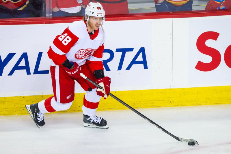 Feb 17, 2024; Calgary, Alberta, CAN; Detroit Red Wings right wing Patrick Kane (88) controls the puck during the warmup period against the Calgary Flames at Scotiabank Saddledome. Mandatory Credit: Sergei Belski-USA TODAY Sports