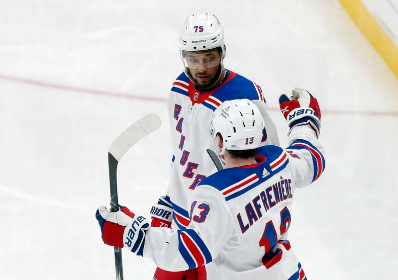 Mar 16, 2024; Pittsburgh, Pennsylvania, USA;  New York Rangers left wing Alexis Lafreniere (13) congratulates defenseman K'Andre Miller (79) after Miller scored a goal against the Pittsburgh Penguins during the third period at PPG Paints Arena. New York won 7-4. Mandatory Credit: Charles LeClaire-USA TODAY Sports