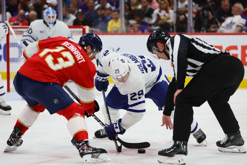 Apr 16, 2024; Sunrise, Florida, USA; Toronto Maple Leafs right wing Pontus Holmberg (29) and Florida Panthers center Sam Reinhart (13) face-off during the second period at Amerant Bank Arena. Mandatory Credit: Sam Navarro-USA TODAY Sports