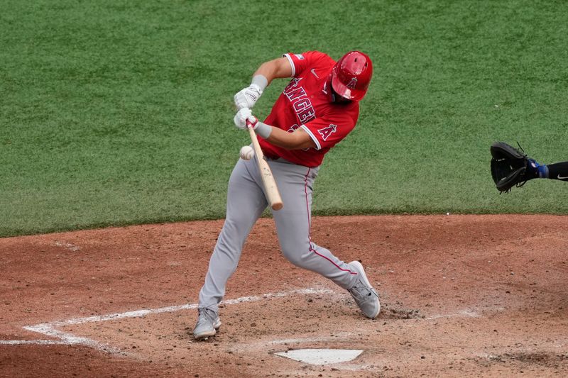 Aug 24, 2024; Toronto, Ontario, CAN; Los Angeles Angels first baseman Niko Kavadas (28) makes contact with a ball during the eighth inning at Rogers Centre. Mandatory Credit: John E. Sokolowski-USA TODAY Sports