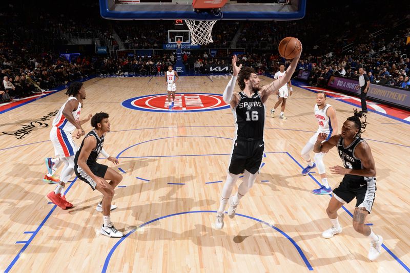 DETROIT, MI - JANUARY 10: Cedi Osman #16 of the San Antonio Spurs grabs a rebound during the game against the Detroit Pistons on January 10, 2024 at Little Caesars Arena in Detroit, Michigan. NOTE TO USER: User expressly acknowledges and agrees that, by downloading and/or using this photograph, User is consenting to the terms and conditions of the Getty Images License Agreement. Mandatory Copyright Notice: Copyright 2024 NBAE (Photo by Chris Schwegler/NBAE via Getty Images)