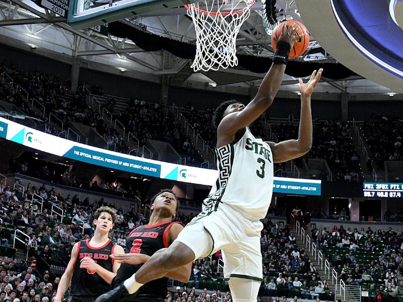 Dec 29, 2025; East Lansing, Michigan, USA;  Michigan State Spartans forward Cameron Ward (3) scores while off balance during the second half against the Cornell Big Red at Jack Breslin Student Events Center. Mandatory Credit: Dale Young-Imagn Images