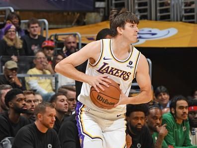 LOS ANGELES, CA - DECEMBER 25: Austin Reaves #15 of the Los Angeles Lakers looks to pass the ball during the game against the Boston Celtics  on December 25, 2023 at Crypto.Com Arena in Los Angeles, California. NOTE TO USER: User expressly acknowledges and agrees that, by downloading and/or using this Photograph, user is consenting to the terms and conditions of the Getty Images License Agreement. Mandatory Copyright Notice: Copyright 2023 NBAE (Photo by Andrew D. Bernstein/NBAE via Getty Images)