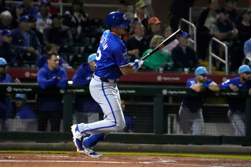 Mar 19, 2024; Scottsdale, Arizona, USA; Kansas City Royals shortstop Nick Loftin (12) hits a single against the San Francisco Giants in the first inning at Scottsdale Stadium. Mandatory Credit: Rick Scuteri-USA TODAY Sports