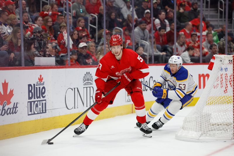 Mar 16, 2024; Detroit, Michigan, USA;  Detroit Red Wings defenseman Moritz Seider (53) skates with the puck chased by Buffalo Sabres left wing Jeff Skinner (53) in the third perio at Little Caesars Arena. Mandatory Credit: Rick Osentoski-USA TODAY Sports