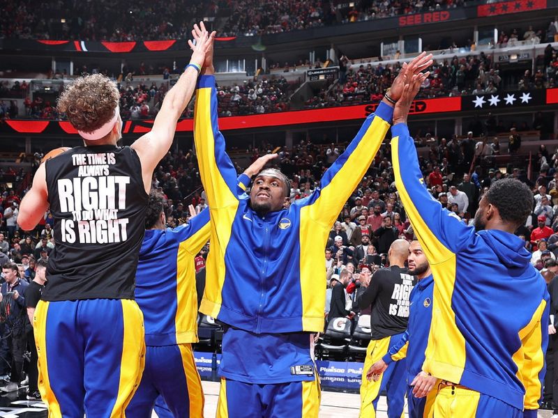 CHICAGO, IL - JANUARY 12: Kevon Looney #5 of the Golden State Warriors is introduced before the game against the Chicago Bulls on January 12, 2024 at United Center in Chicago, Illinois. NOTE TO USER: User expressly acknowledges and agrees that, by downloading and or using this photograph, User is consenting to the terms and conditions of the Getty Images License Agreement. Mandatory Copyright Notice: Copyright 2024 NBAE (Photo by Jeff Haynes/NBAE via Getty Images)