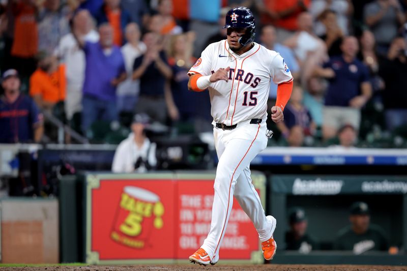 May 28, 2025; Houston, Texas, USA; Houston Astros third baseman Isaac Paredes (15) crosses home plate to score a run against the Athletics during the seventh inning at Daikin Park. Mandatory Credit: Erik Williams-Imagn Images