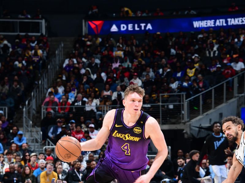 ATLANTA, GA - DECEMBER 6: Dalton Knecht #4 of the Los Angeles Lakers handles the ball during the game against the Atlanta Hawks on December 6, 2024 at State Farm Arena in Atlanta, Georgia.  NOTE TO USER: User expressly acknowledges and agrees that, by downloading and/or using this Photograph, user is consenting to the terms and conditions of the Getty Images License Agreement. Mandatory Copyright Notice: Copyright 2024 NBAE (Photo by Scott Cunningham/NBAE via Getty Images)