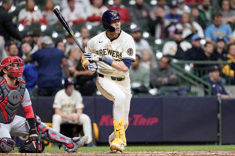 May 9, 2024; Milwaukee, Wisconsin, USA;  Milwaukee Brewers left fielder Christian Yelich (22) hits an RBI triple during the fifth inning against the St. Louis Cardinals at American Family Field. Mandatory Credit: Jeff Hanisch-USA TODAY Sports