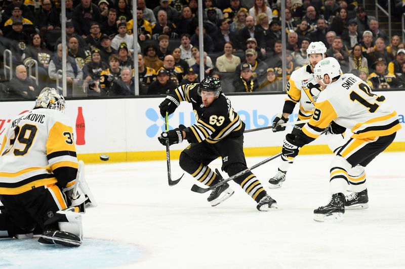 Jan 4, 2024; Boston, Massachusetts, USA;  Boston Bruins left wing Brad Marchand (63) scores a shorthanded goal past Pittsburgh Penguins goaltender Alex Nedeljkovic (39) during the third period at TD Garden. Mandatory Credit: Bob DeChiara-USA TODAY Sports