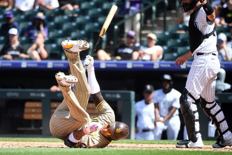 Aug 18, 2024; Denver, Colorado, USA; San Diego Padres third baseman Manny Machado (13) avoids getting hit by a pitch in the fifth inning against the Colorado Rockies at Coors Field. Mandatory Credit: Christopher Hanewinckel-USA TODAY Sports