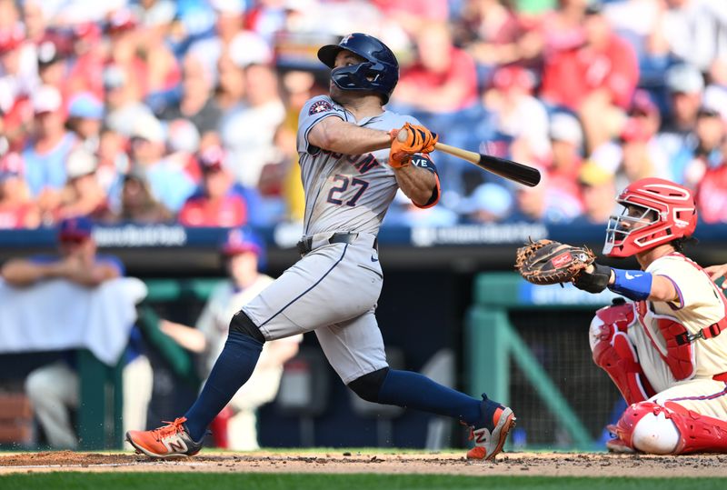 Aug 28, 2024; Philadelphia, Pennsylvania, USA; Houston Astros infielder Jose Altuve (27) hits a single against the Philadelphia Phillies in the third inning at Citizens Bank Park. Mandatory Credit: Kyle Ross-USA TODAY Sports