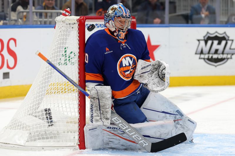 Nov 5, 2024; Elmont, New York, USA; New York Islanders goaltender Ilya Sorokin (30) makes a save against the Pittsburgh Penguins during the first period at UBS Arena. Mandatory Credit: Brad Penner-Imagn Images