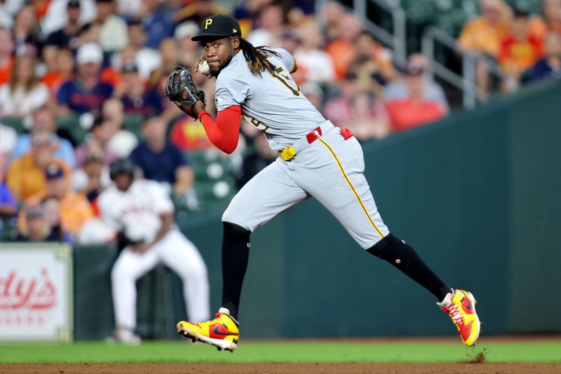 Jul 31, 2024; Houston, Texas, USA; Pittsburgh Pirates shortstop Oneil Cruz (15) throws to first base for an out against the Houston Astros during the fifth inning at Minute Maid Park. Mandatory Credit: Erik Williams-USA TODAY Sports