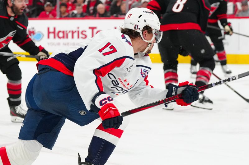 May 12, 2025; Raleigh, North Carolina, USA; Washington Capitals center Dylan Strome (17) takes a shot against the Carolina Hurricanes during the second period in game four of the second round of the 2025 Stanley Cup Playoffs at Lenovo Center. Mandatory Credit: James Guillory-Imagn Images