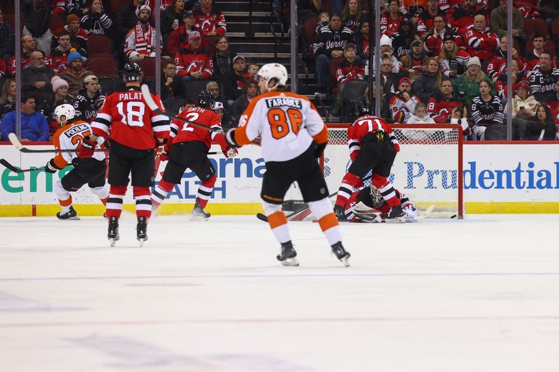 Dec 19, 2023; Newark, New Jersey, USA; Philadelphia Flyers center Ryan Poehling (25) scores a goal on New Jersey Devils goaltender Vitek Vanecek (41) during the second period at Prudential Center. Mandatory Credit: Ed Mulholland-USA TODAY Sports