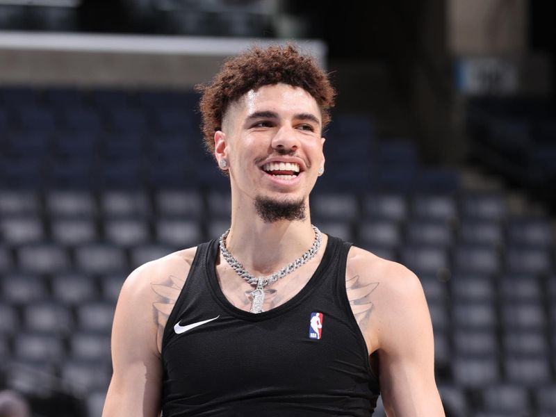 MEMPHIS, TN - OCTOBER 10: LaMelo Ball #1 of the Charlotte Hornets smiles before the game against the Memphis Grizzlies during a NBA Preseason game on October 10, 2024 at FedExForum in Memphis, Tennessee. NOTE TO USER: User expressly acknowledges and agrees that, by downloading and or using this photograph, User is consenting to the terms and conditions of the Getty Images License Agreement. Mandatory Copyright Notice: Copyright 2024 NBAE (Photo by Joe Murphy/NBAE via Getty Images)