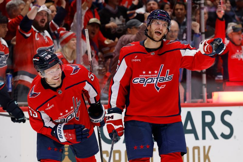 Oct 21, 2025; Washington, District of Columbia, USA; Washington Capitals center Nic Dowd (26) celebrates with Capitals center Ethen Frank (53) after scoring a goal against the Seattle Kraken during the first period at Capital One Arena. Mandatory Credit: Geoff Burke-Imagn Images