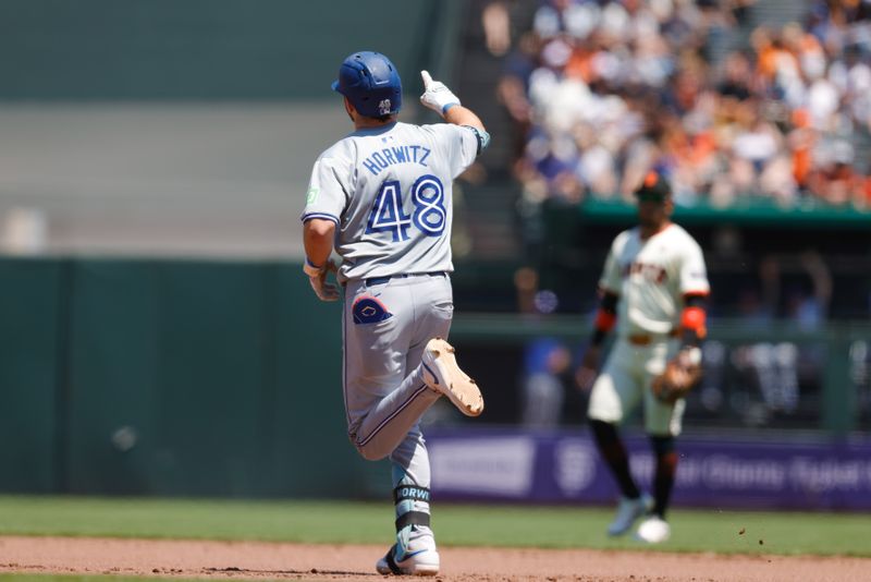 Jul 11, 2024; San Francisco, California, USA; Toronto Blue Jays second base Spencer Horwitz (48) rounds the bases after hitting a one run home run during the fifth inning at Oracle Park. Mandatory Credit: Sergio Estrada-USA TODAY Sports