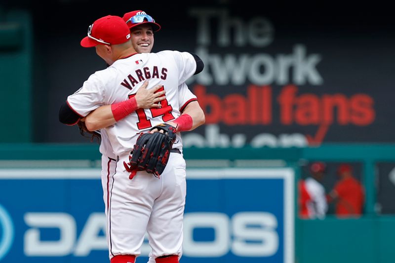 Jul 21, 2024; Washington, District of Columbia, USA; Washington Nationals outfielder Lane Thomas (28) celebrates with Nationals second base Ildemaro Vargas (14) after their game against the Cincinnati Redsat Nationals Park. Mandatory Credit: Geoff Burke-USA TODAY Sports