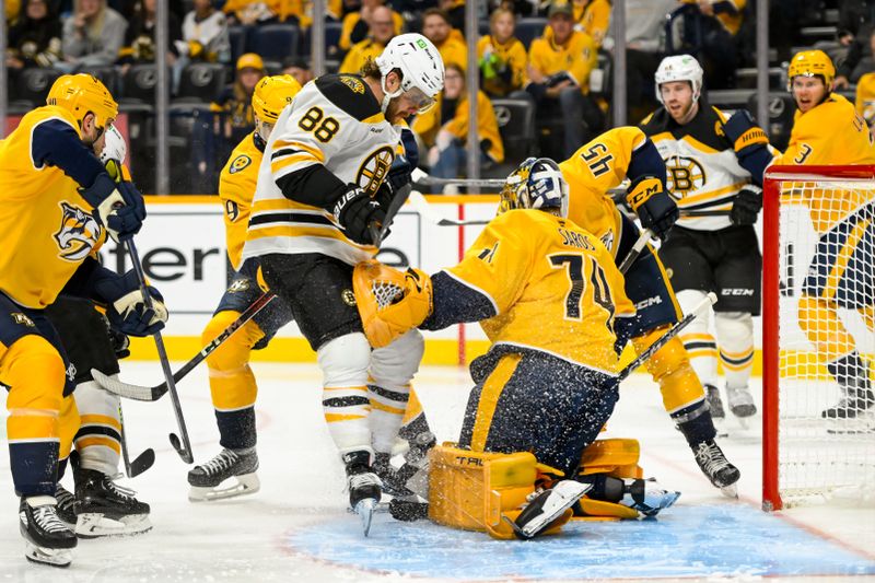 Oct 22, 2024; Nashville, Tennessee, USA;  Nashville Predators goaltender Juuse Saros (74) blocks the shot of Boston Bruins right wing David Pastrnak (88) during the second period at Bridgestone Arena. Mandatory Credit: Steve Roberts-Imagn Images