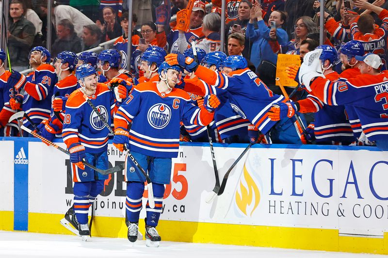 Apr 15, 2024; Edmonton, Alberta, CAN; The Edmonton Oilers celebrate a goal scored by forward Zach Hyman (18), during the second period against the San Jose Sharks at Rogers Place. The goal was assisted by forward Connor McDavid (97), his 100th of the season making him only the fourth player in NHL history history to record 100 assists in a single season. Mandatory Credit: Perry Nelson-USA TODAY Sports