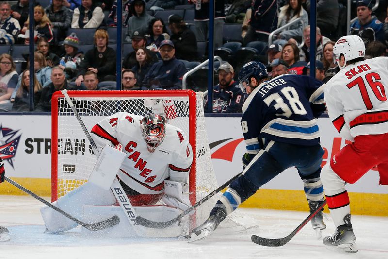 Feb 29, 2024; Columbus, Ohio, USA; Columbus Blue Jackets center Boone Jenner (38) reaches for the rebound of a Carolina Hurricanes goalie Spencer Martin (41) save during the third period at Nationwide Arena. Mandatory Credit: Russell LaBounty-USA TODAY Sports