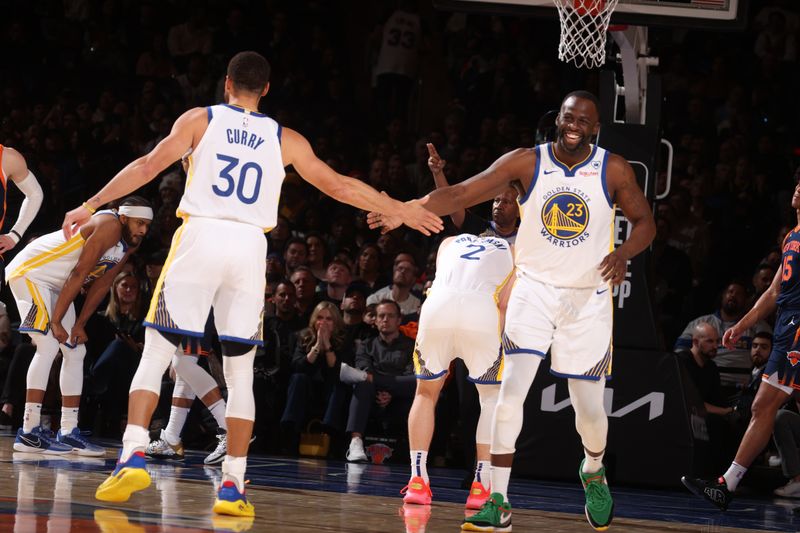 NEW YORK, NY - FEBRUARY 29: Draymond Green #23 high fives Stephen Curry #30 of the Golden State Warriors during the game against the New York Knicks on January 29, 2024 at Madison Square Garden in New York City, New York.  NOTE TO USER: User expressly acknowledges and agrees that, by downloading and or using this photograph, User is consenting to the terms and conditions of the Getty Images License Agreement. Mandatory Copyright Notice: Copyright 2024 NBAE  (Photo by Nathaniel S. Butler/NBAE via Getty Images)