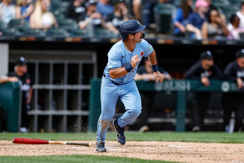 May 27, 2024; Chicago, Illinois, USA; Toronto Blue Jays outfielder Davis Schneider (36) watches his two-run home run against the Chicago White Sox during the ninth inning at Guaranteed Rate Field. Mandatory Credit: Kamil Krzaczynski-USA TODAY Sports