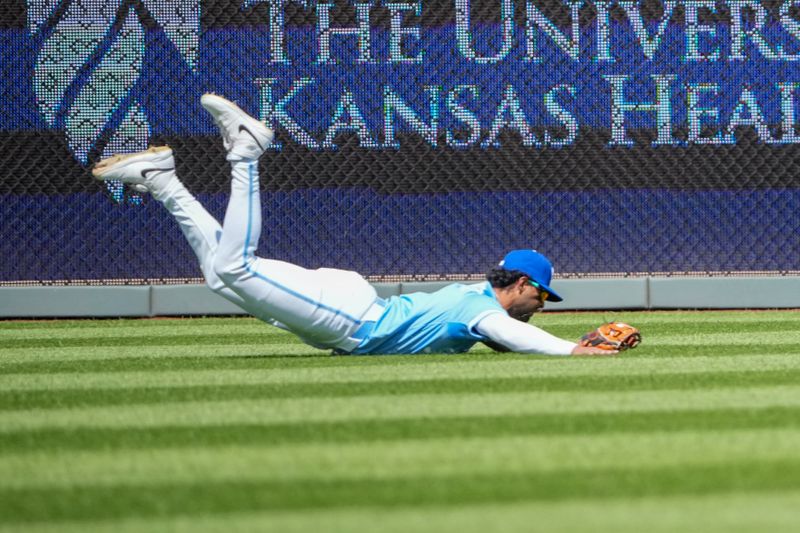 Apr 10, 2025; Kansas City, Missouri, USA; Kansas City Royals left fielder MJ Melendez (1) makes a diving catch on a long fly ball against the Minnesota Twins in the fourth inning at Kauffman Stadium. Mandatory Credit: Denny Medley-Imagn Images