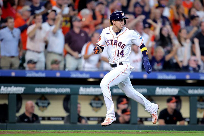 Sep 20, 2023; Houston, Texas, USA; Houston Astros pinch hitter Mauricio Dubon (14) runs towards home plate to score a run against the Baltimore Orioles during the eighth inning at Minute Maid Park. Mandatory Credit: Erik Williams-USA TODAY Sports