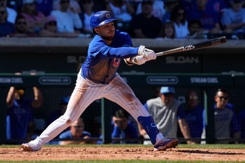 Mar 1, 2024; Mesa, Arizona, USA; Chicago Cubs third baseman Nick Madrigal (1) strikes out against the Chicago White Sox during the third inning at Sloan Park. Mandatory Credit: Rick Scuteri-USA TODAY Sports