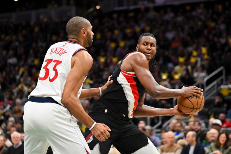 SEATTLE, WASHINGTON - OCTOBER 11: Jabari Walker #34 of the Portland Trail Blazers controls the ball against Nicolas Batum #33 of the LA Clippers during the first quarter of the Rain City Showcase game at Climate Pledge Arena on October 11, 2024 in Seattle, Washington. The LA Clippers won 101-99. NOTE TO USER: User expressly acknowledges and agrees that, by downloading and or using this photograph, User is consenting to the terms and conditions of the Getty Images License Agreement. (Photo by Alika Jenner/Getty Images)