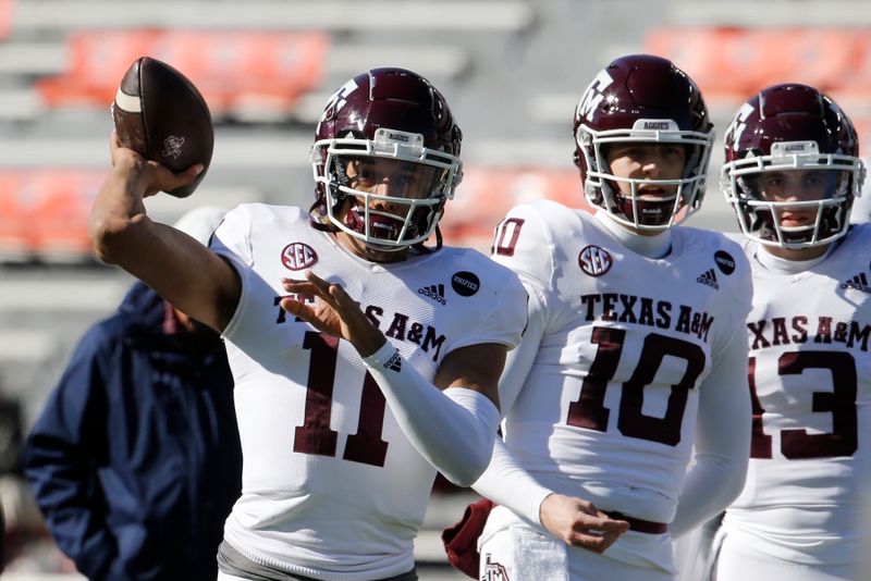 Dec 5, 2020; Auburn, Alabama, USA;  Texas A&M Aggies quarterback Kellen Mond (11) warms up before the game against the Auburn Tigers at Jordan-Hare Stadium. Mandatory Credit: John Reed-USA TODAY Sports