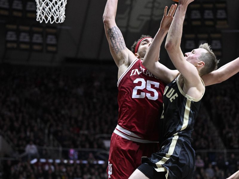 Feb 25, 2023; West Lafayette, Indiana, USA; Indiana Hoosiers forward Race Thompson (25) blocks a shot by Purdue Boilermakers guard Fletcher Loyer (2) during the second half at Mackey Arena. Indiana won 79-71. Mandatory Credit: Marc Lebryk-USA TODAY Sports