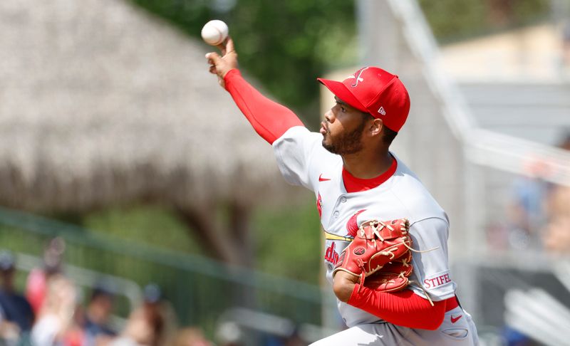 Mar 16, 2025; Jupiter, Florida, USA;  St. Louis Cardinals pitcher Dionys Rodriguez (84) pitches against the Miami Marlins during the third inning  at Roger Dean Chevrolet Stadium. Mandatory Credit: Rhona Wise-Imagn Images