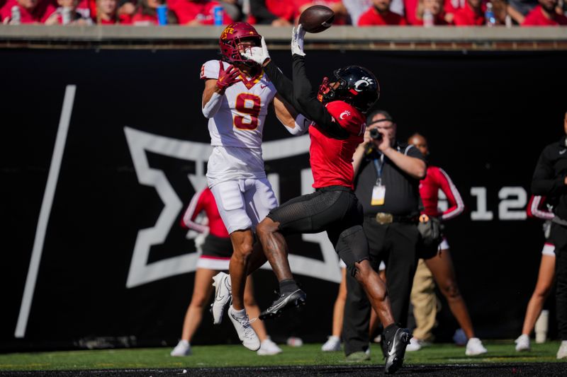 Oct 14, 2023; Cincinnati, Ohio, USA;  Cincinnati Bearcats defensive back Taj Ward (15) breaks up a pass intended for Iowa State Cyclones wide receiver Jayden Higgins (9) in the first half at Nippert Stadium. Mandatory Credit: Aaron Doster-USA TODAY Sports